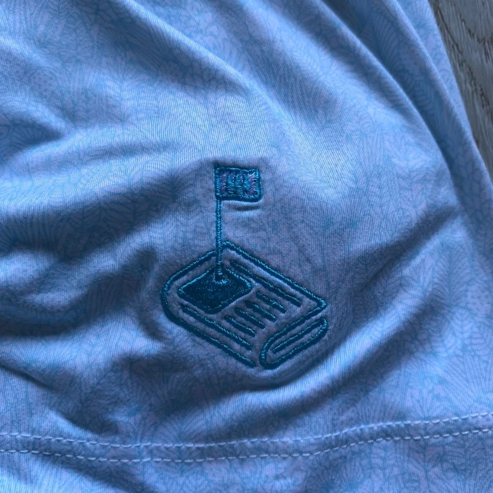 Johnnie-O Clegg Solid Piqué‎ Performance Golf Polo in light blue